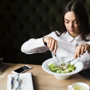 Woman Eating Salad - Contact Us